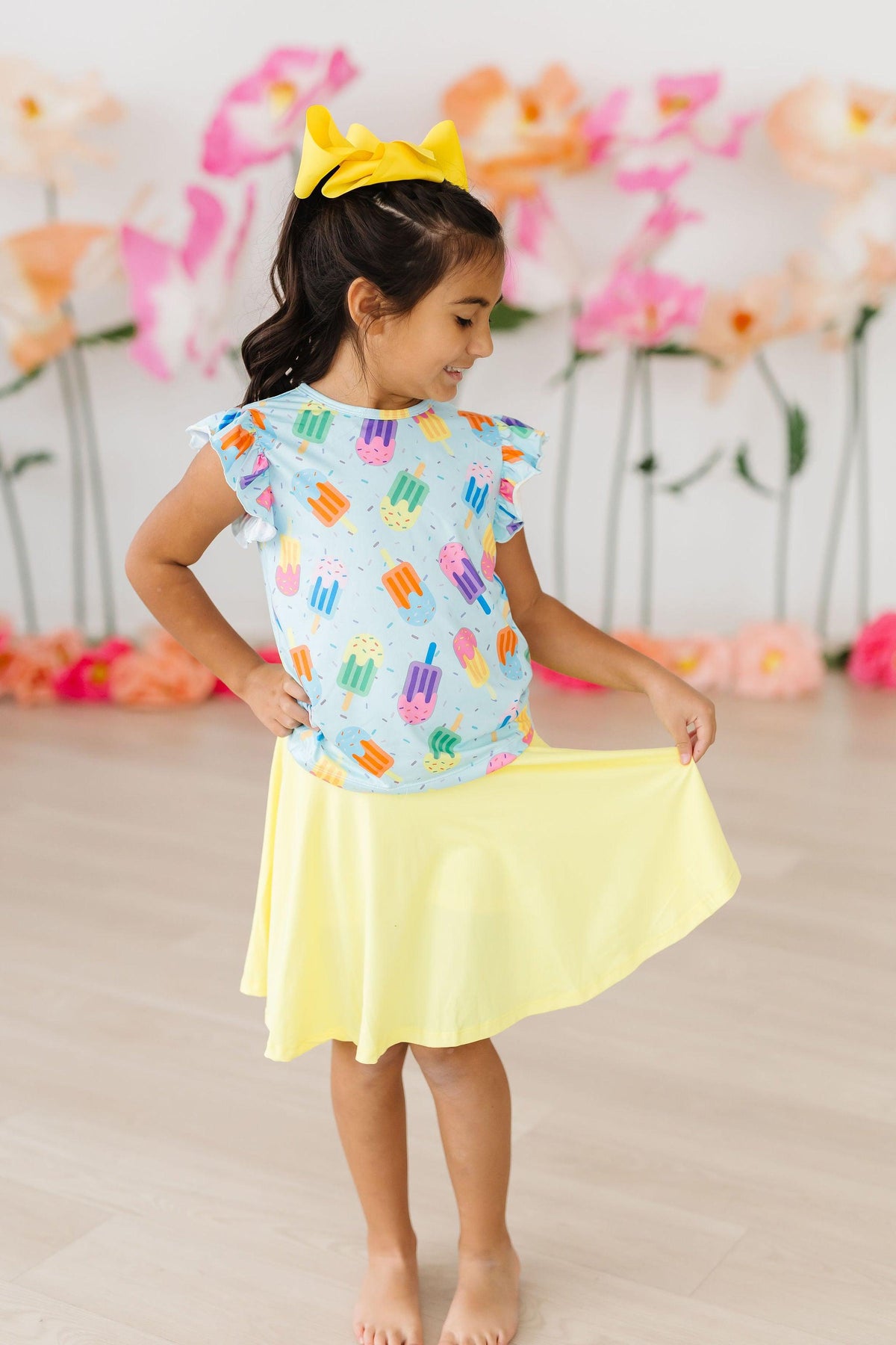 a girl in a yellow skirt