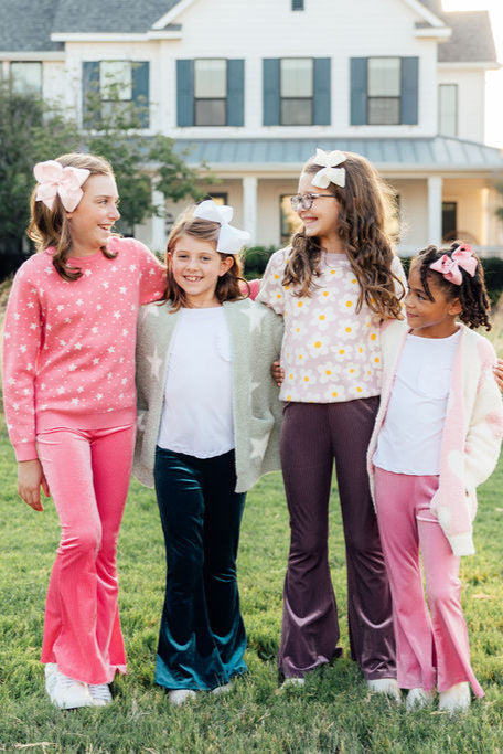 a group of girls standing in a line