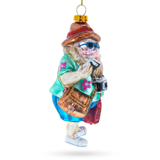 a christmas ornament with a woman holding a phone