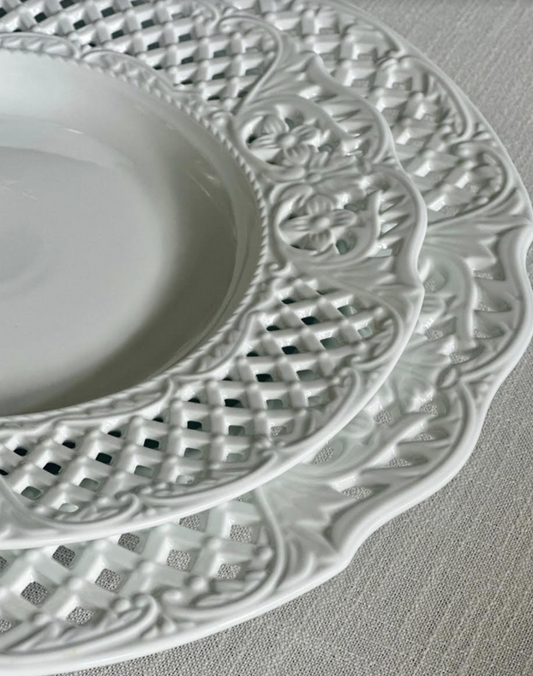 a stack of white plates