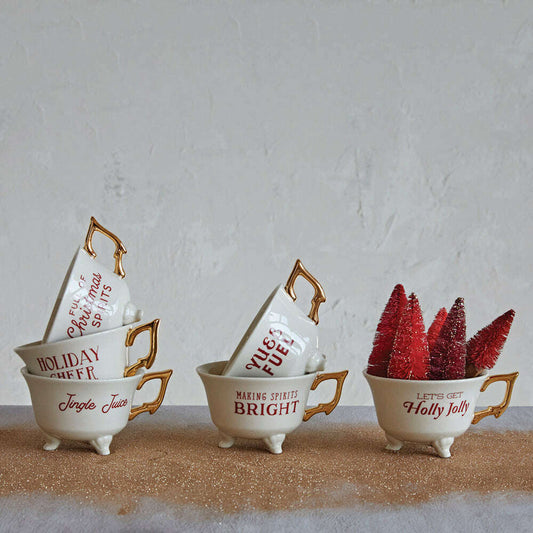 a group of teacups with red and white decorations