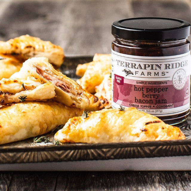 a plate of food and a jar of jam