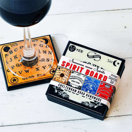 a glass of wine next to a coaster