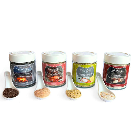 a group of containers with different spices and spoons
