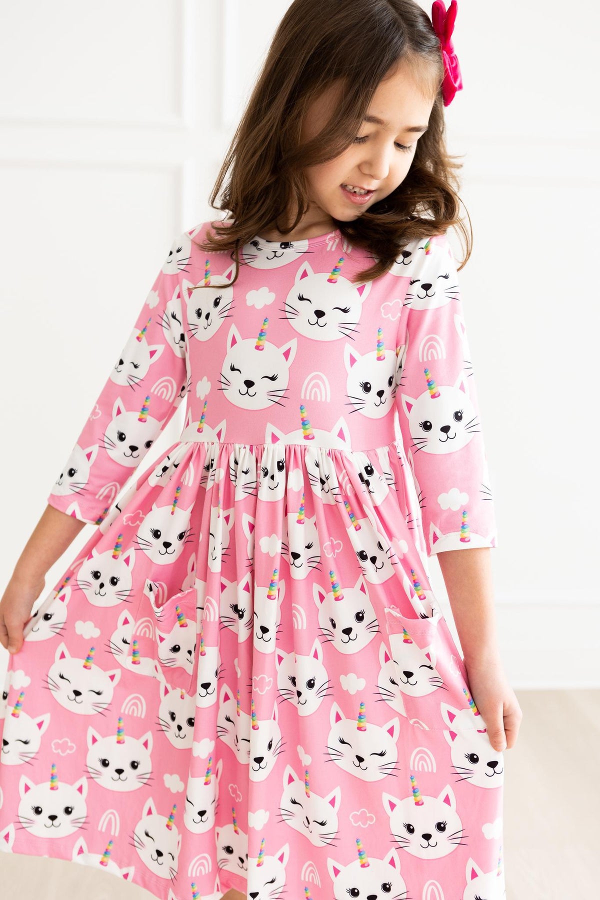 a girl in a pink dress