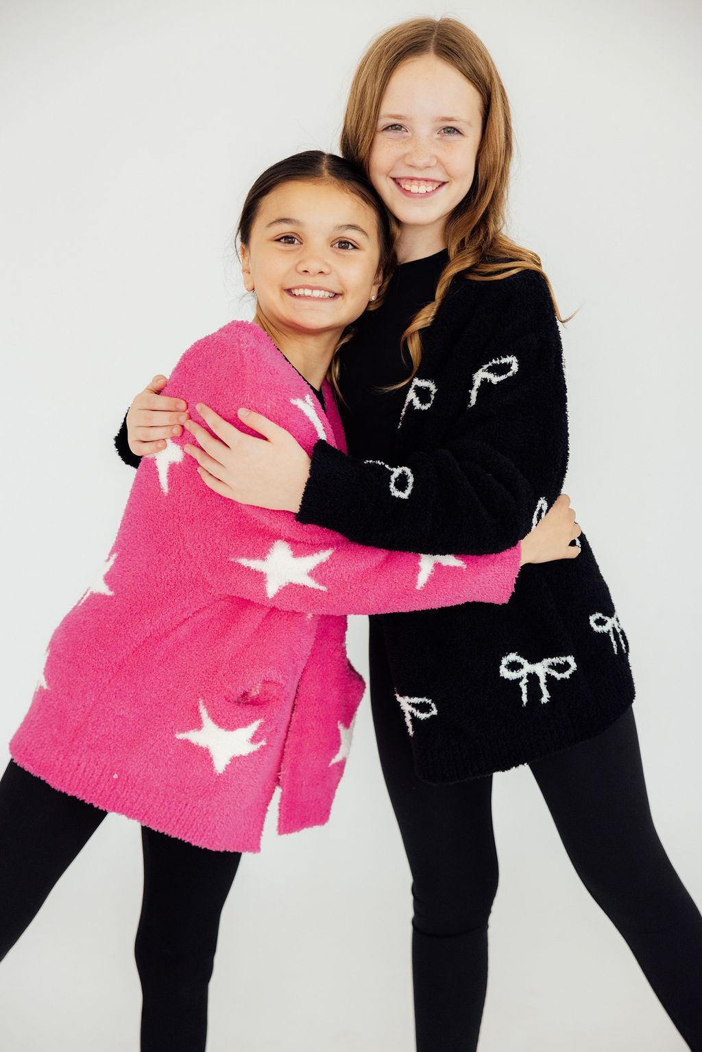 two girls hugging each other