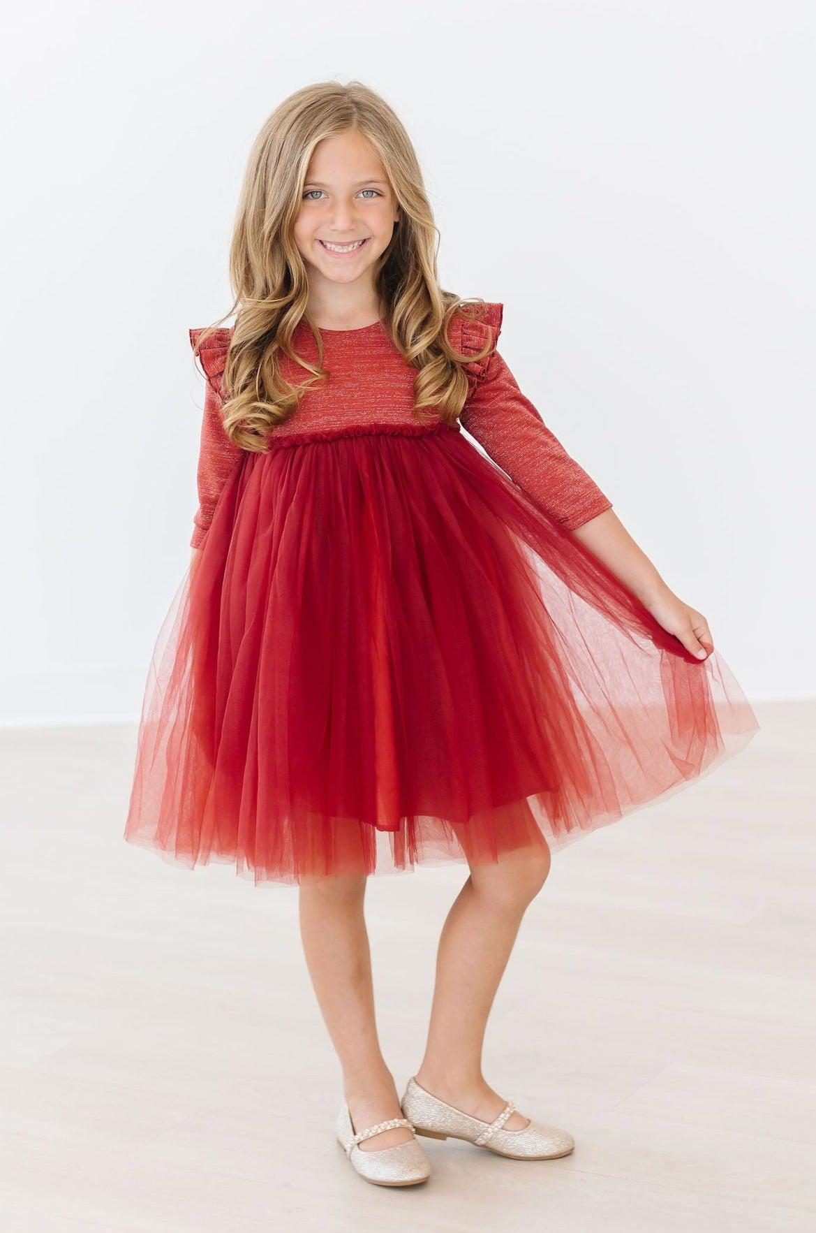 a girl in a red dress
