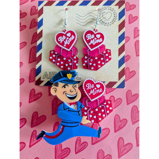 a pair of earrings on a envelope
