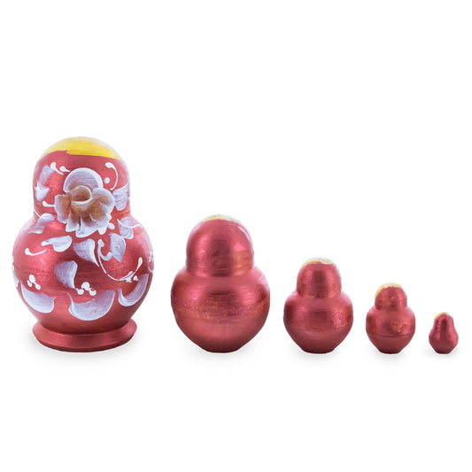 a group of red and gold nesting dolls
