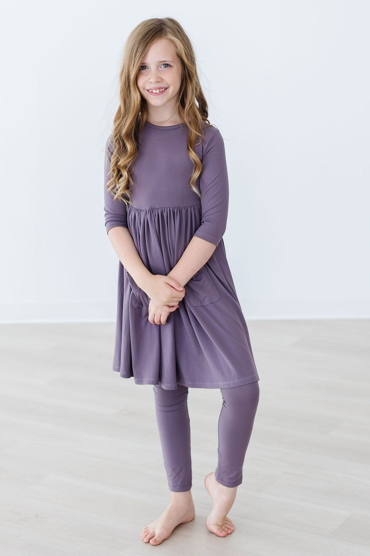 a girl in a purple dress