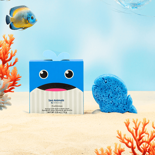a blue box with a blue whale and a blue sponge in the sand