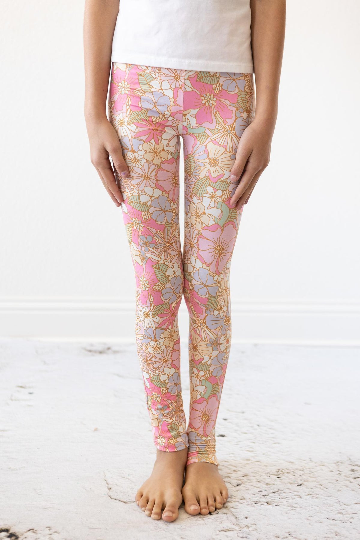 a person wearing leggings with floral print