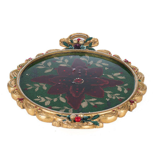 a decorative plate with a flower painted on it