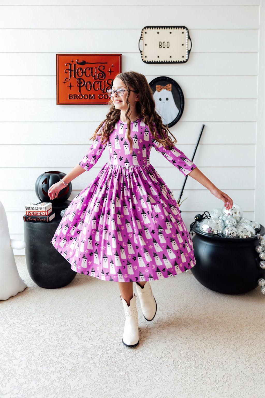 a girl in a purple dress