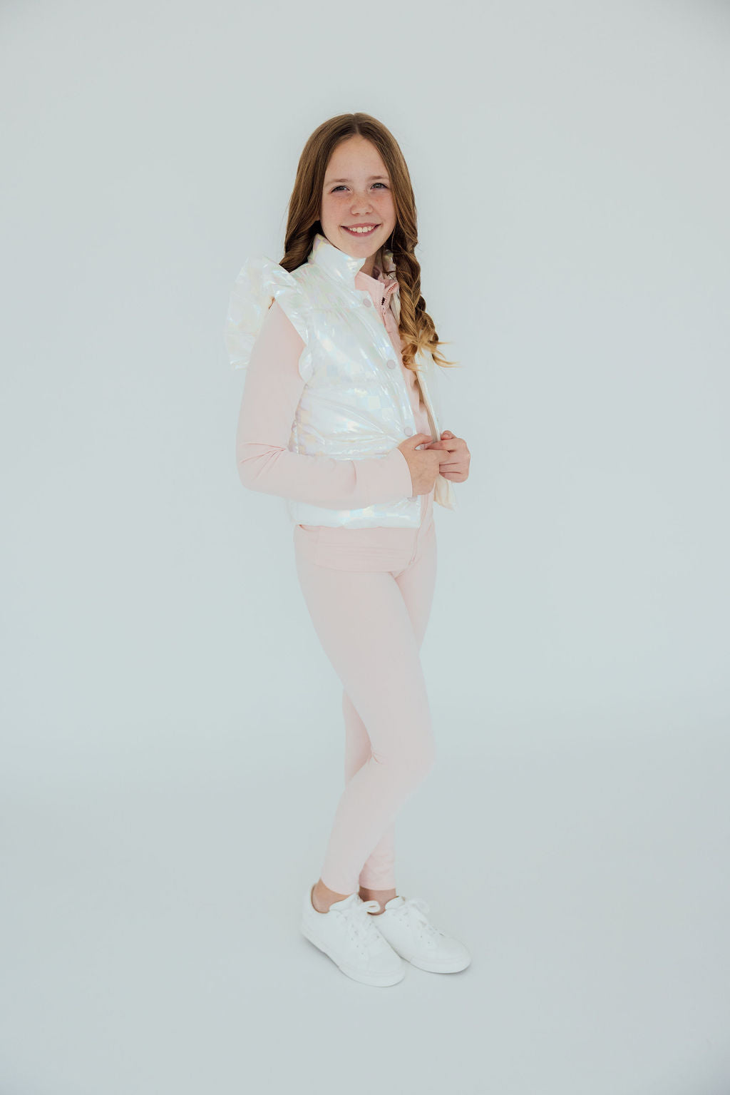 a girl in a pink outfit