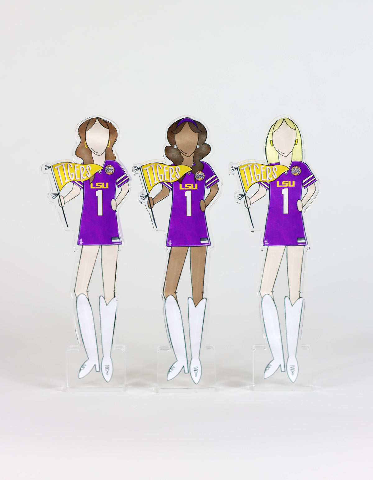 a group of cut out paper dolls