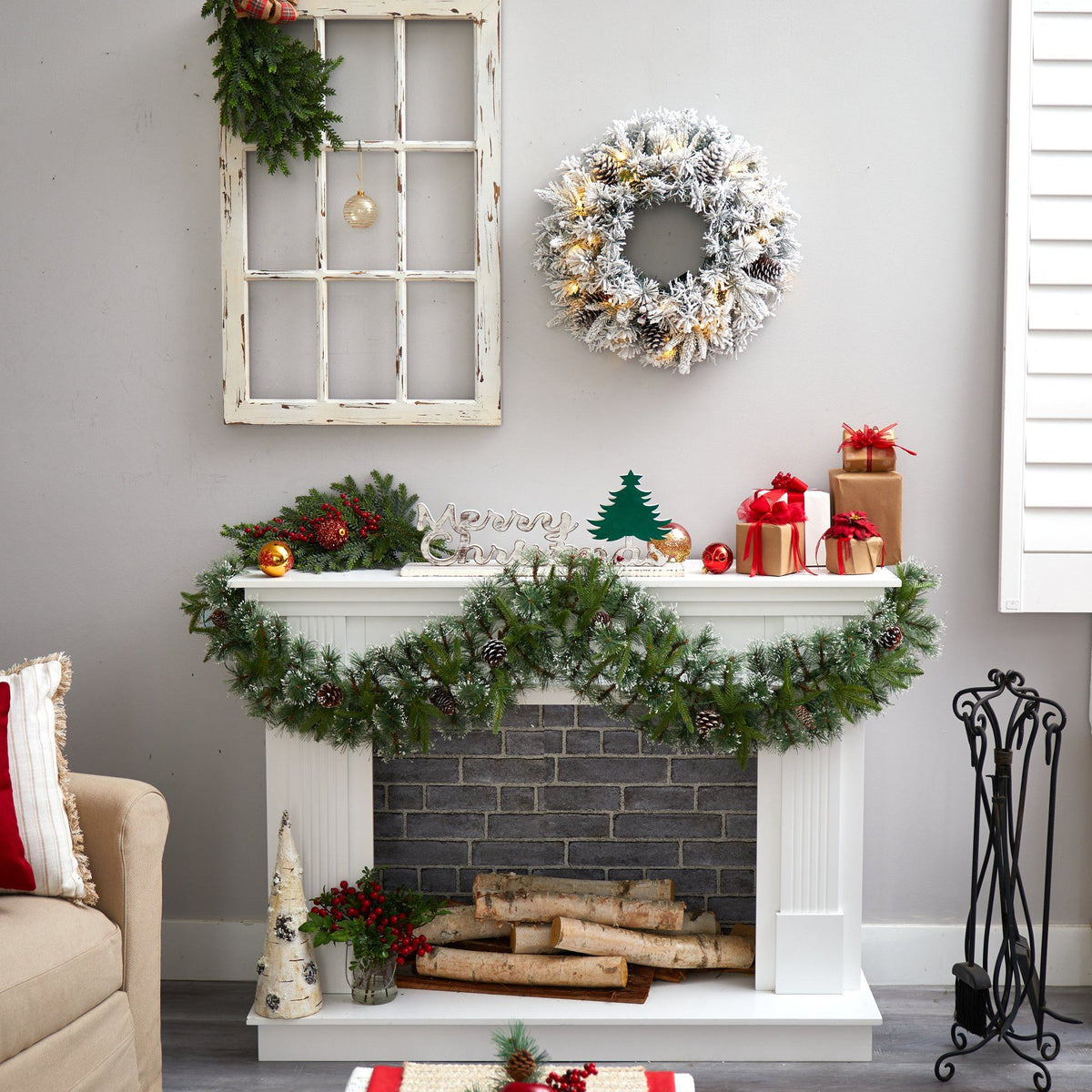 a fireplace with wreaths and a wreath on the wall