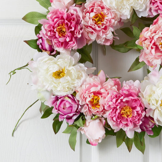 a wreath of flowers on a door