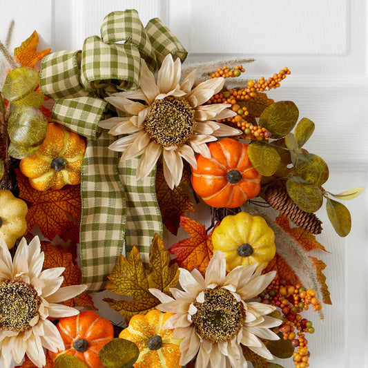a wreath with flowers and leaves