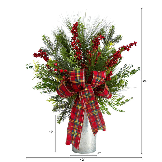 a tall vase with red and green plants and a red bow