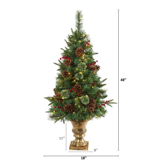 a tall christmas tree with lights and pine cones