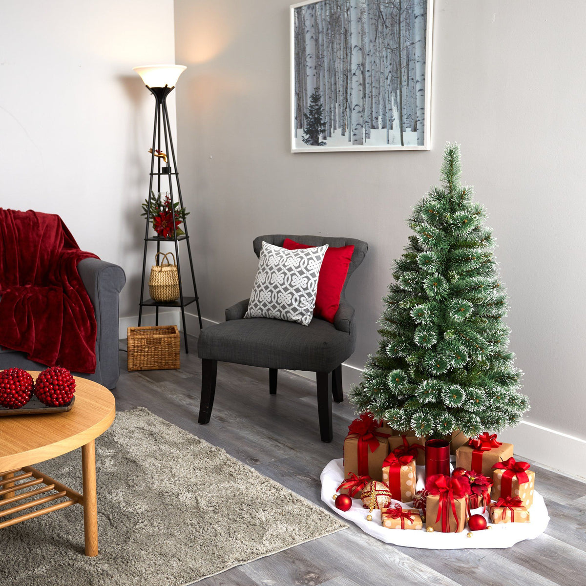 a christmas tree with presents under it