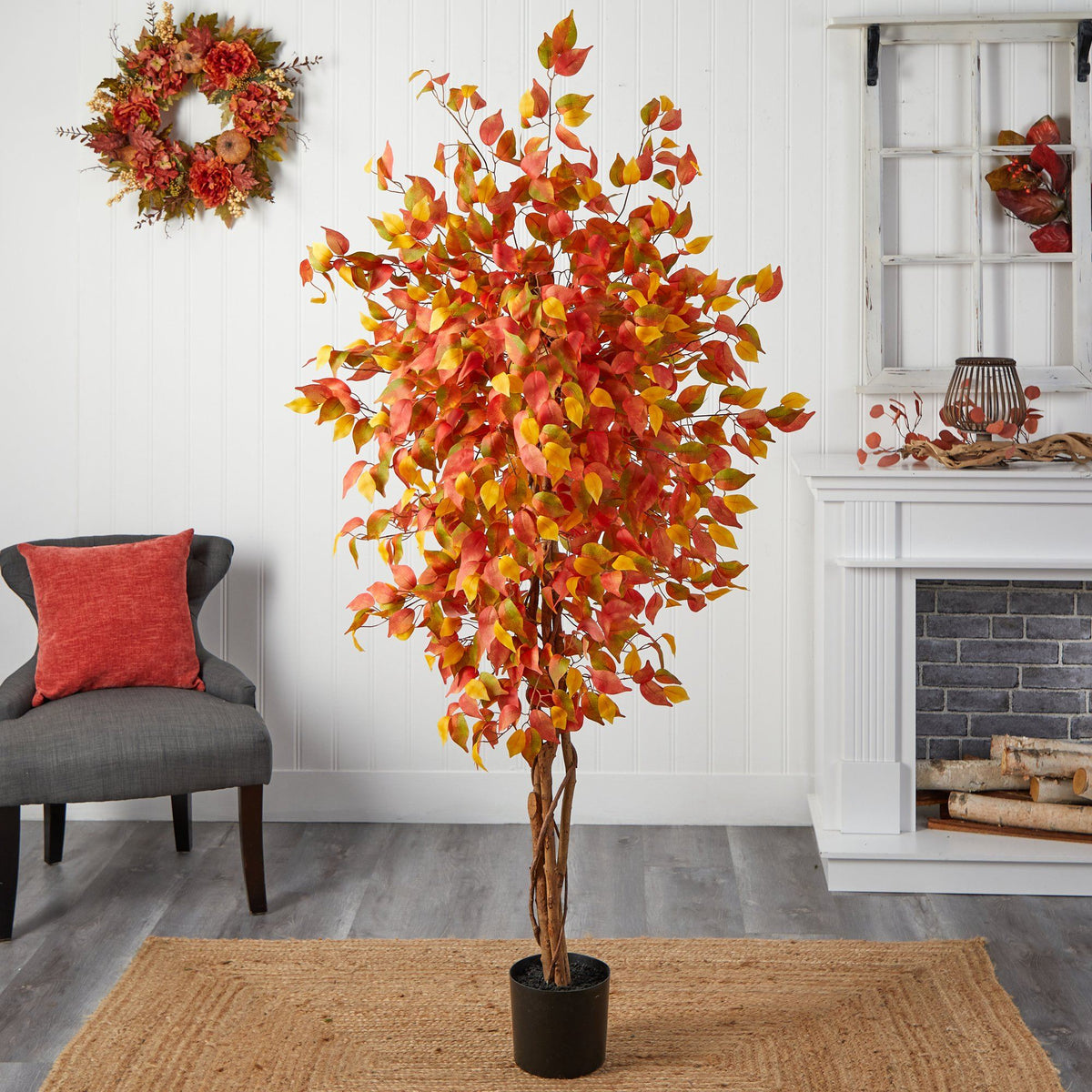 a tree in a room with a fireplace and a chair