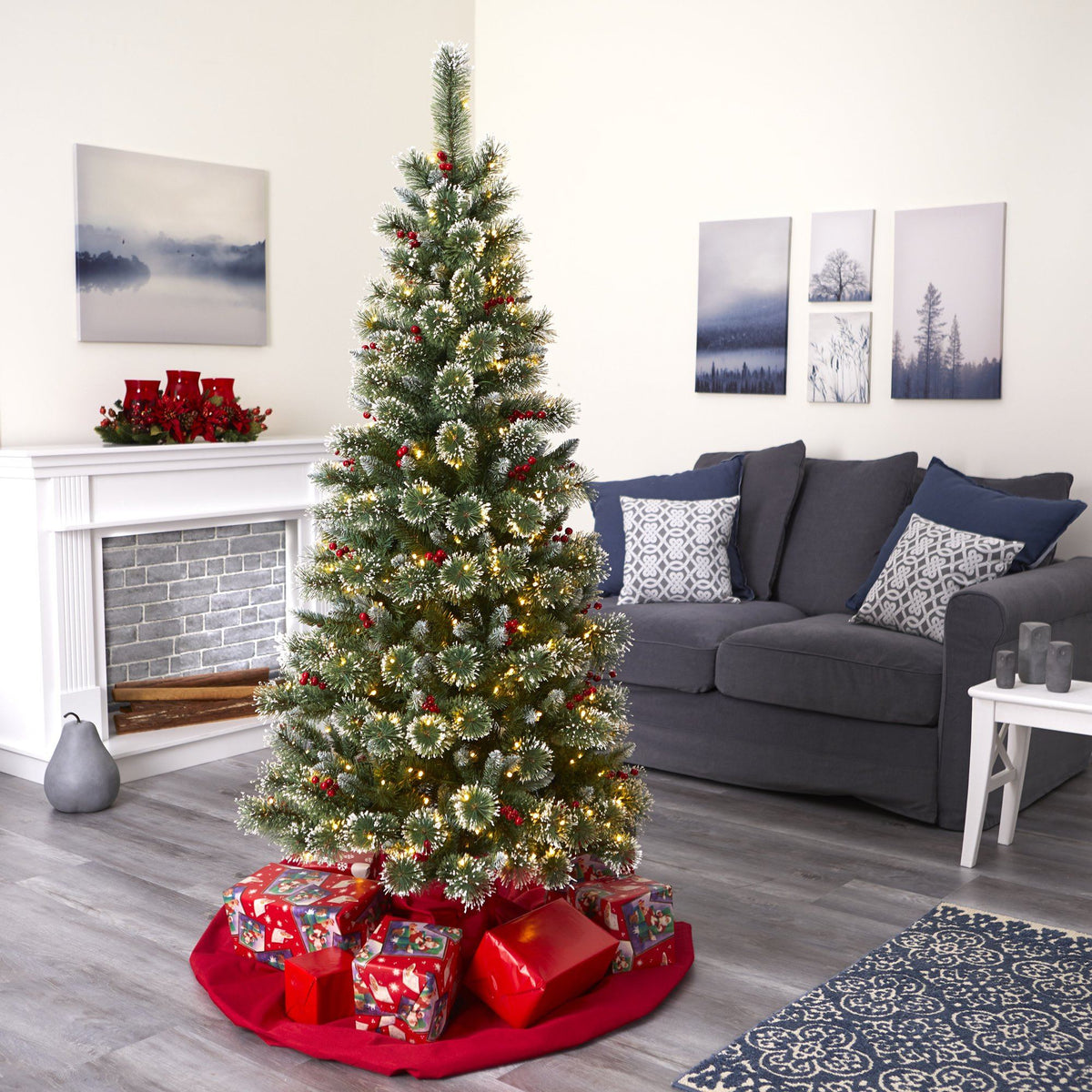 a christmas tree with presents in a room