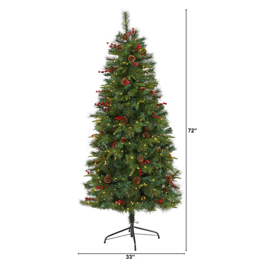 a tall christmas tree with lights and ornaments