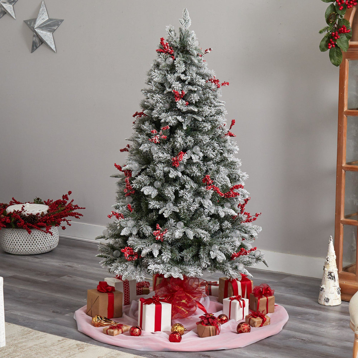 a christmas tree with presents under it