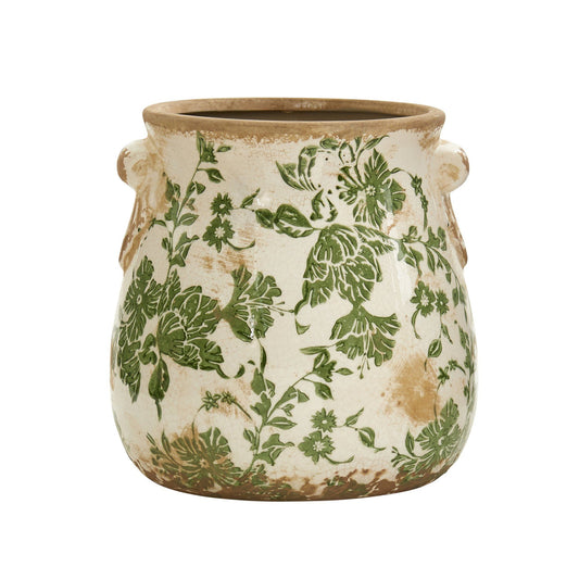 a green and white vase with handles