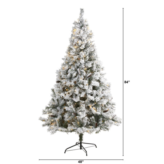 a tall christmas tree with lights