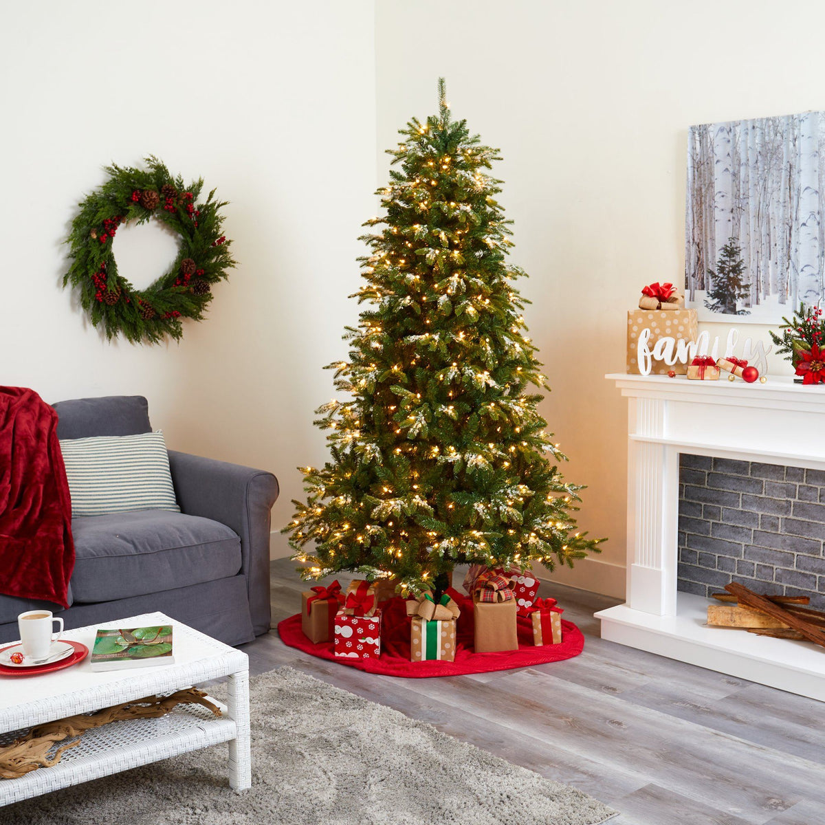 a christmas tree with presents in a living room