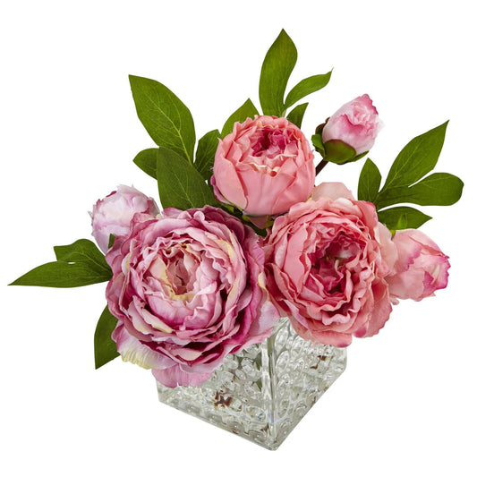 a glass vase with pink flowers