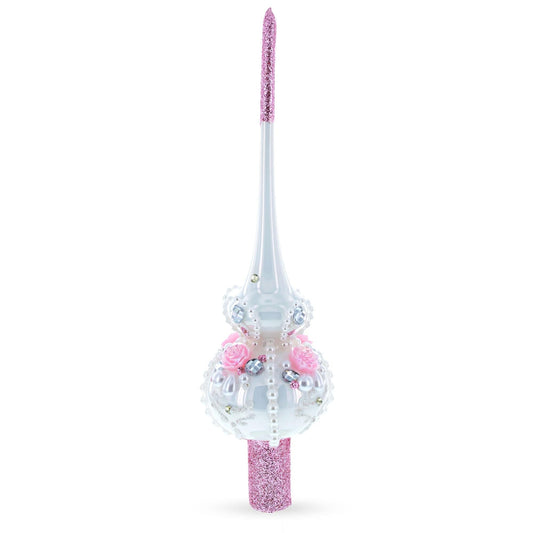 a white and pink christmas tree topper