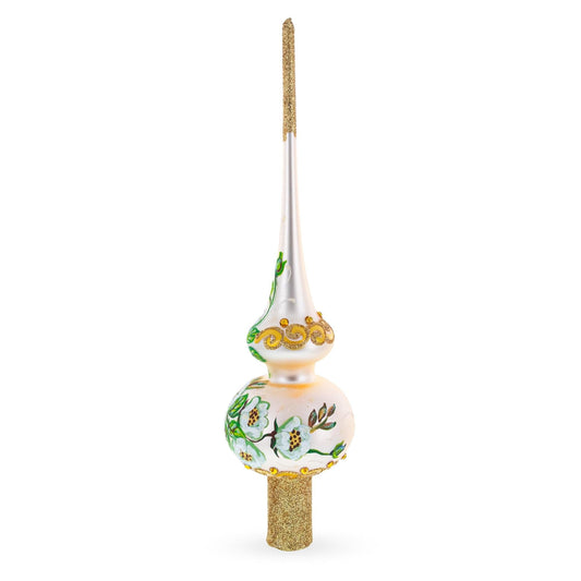 a white and gold christmas tree topper
