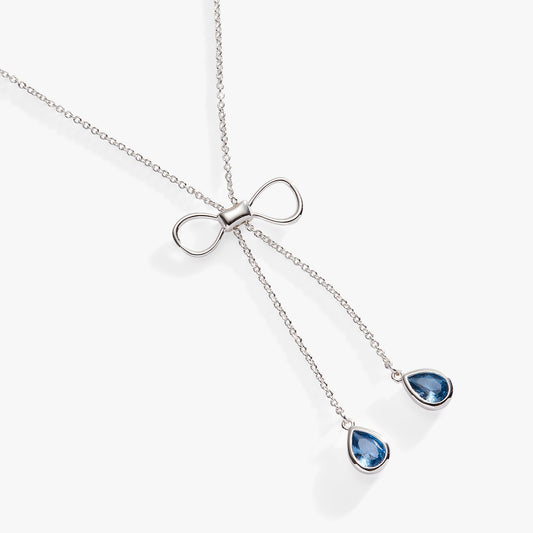 a necklace with blue gems on it
