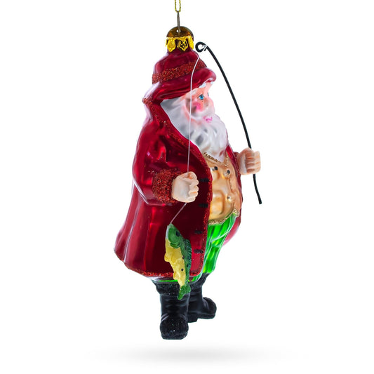 a christmas ornament with a santa claus holding a fishing rod
