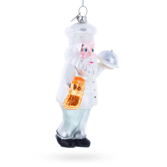 a christmas ornament of a santa claus holding a tray