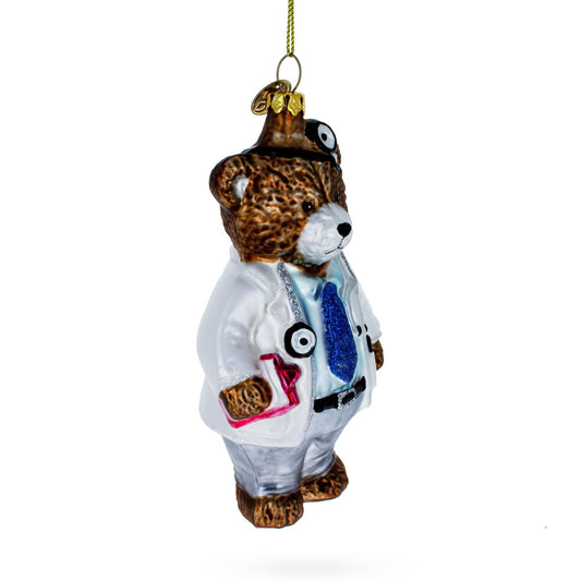 a christmas ornament of a bear wearing a doctor garment
