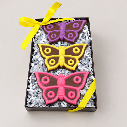 a box of cookies with butterflies