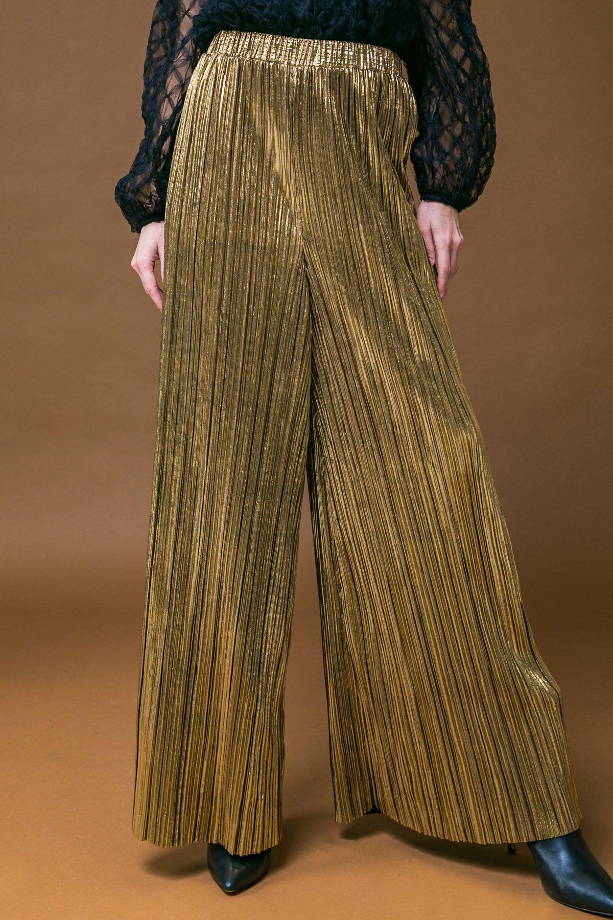 a person wearing a gold pants