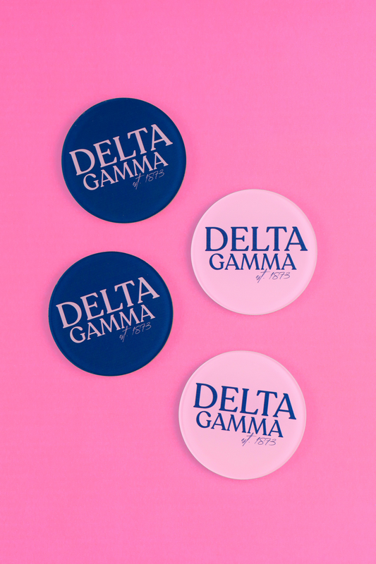 a group of blue and pink badges