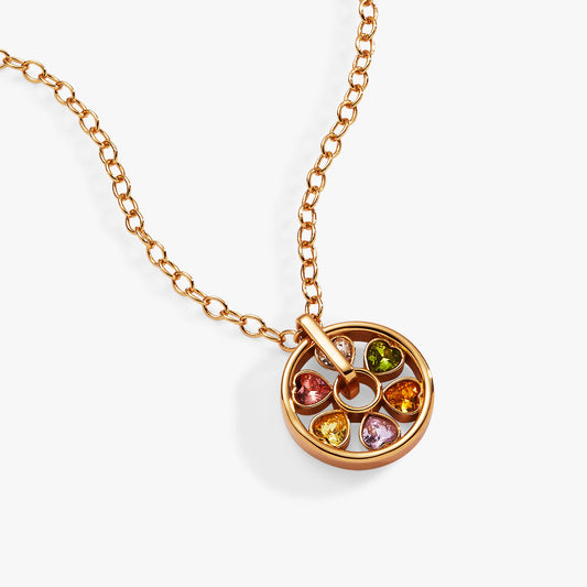 a gold necklace with multicolored stones