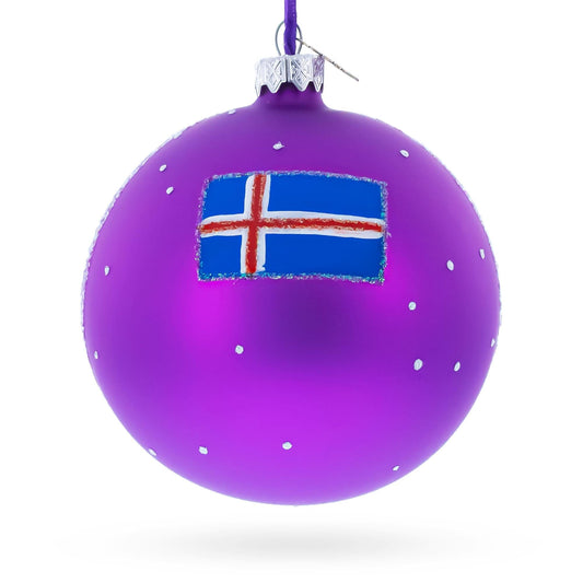 a purple christmas ornament with a flag painted on it