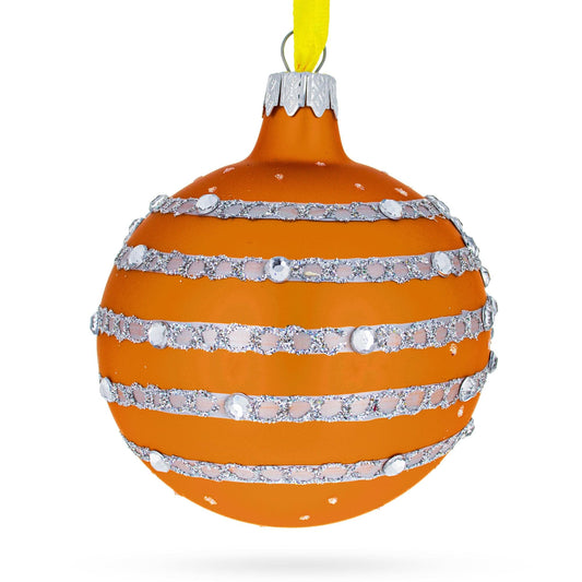 an orange and silver striped ornament