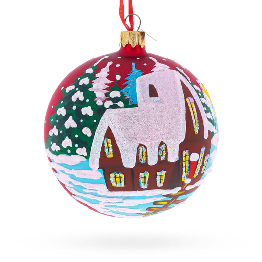 a christmas ornament with a painting on it