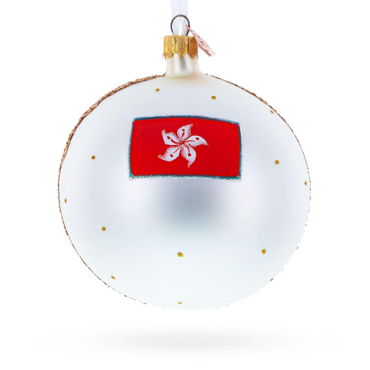 a white and gold christmas ornament