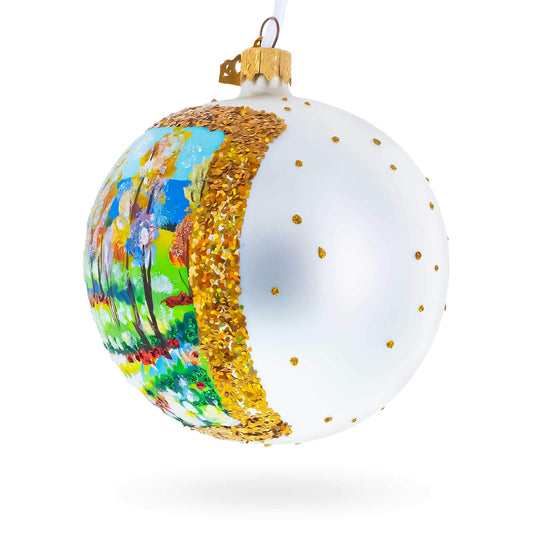a white and gold christmas ornament
