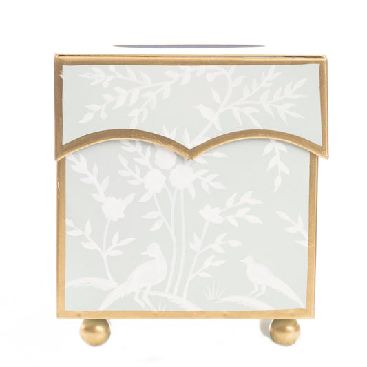 a white box with gold trim